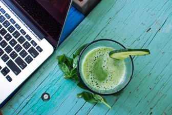 Morning juice next to Macbook